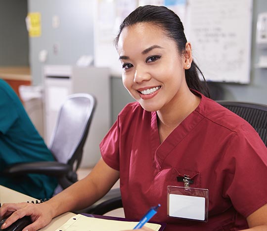 Nurse sitting at a desk